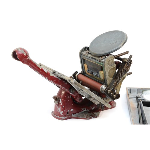 61 - An Adana letter press, no. 781146 and 800575, with an assortment of accessories, to include, an Adan... 