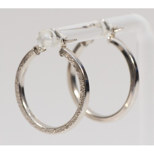 64 - A pair of 375, 9ct white gold hoop earrings, diameter 22mm, 1.8gm.