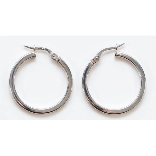 64 - A pair of 375, 9ct white gold hoop earrings, diameter 22mm, 1.8gm.