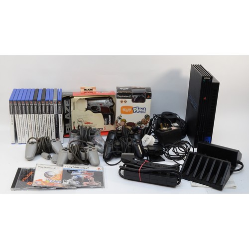 67 - A Playstation 2 (PS2) console with original instruction manual, together with five controllers, a Sc... 