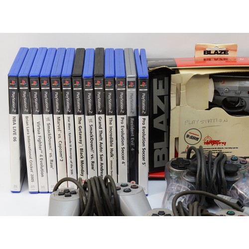 67 - A Playstation 2 (PS2) console with original instruction manual, together with five controllers, a Sc... 