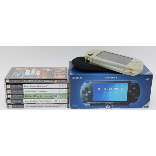 73 - A PSP console, model no. PSP-1003 G1, boxed, together with six games, to include, Prince of Persia R... 