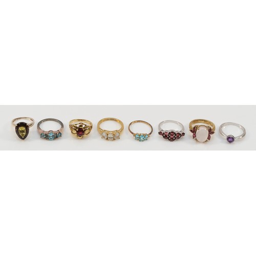 140 - Eight silver and silver gilt and gemstone set rings, including topaz and garnet, L - P, 27gm (8)