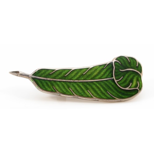 142 - Holland & Holland, a silver and enamel  brooch in the form of a green feather, Birmingham 2000, Mill... 