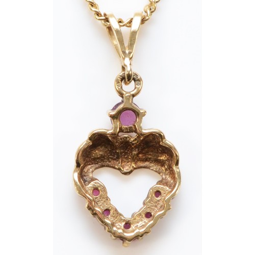 183 - A 9ct gold ruby heart pendant with a chain, 15mm pendant length, 3.8g