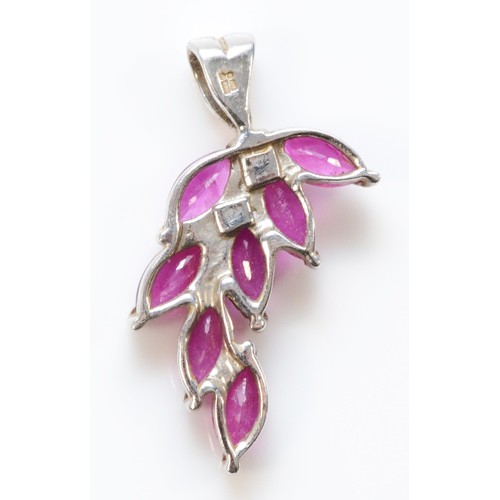 186 - A 9ct white gold ruby pendant, 20mm total drop, 1.8g