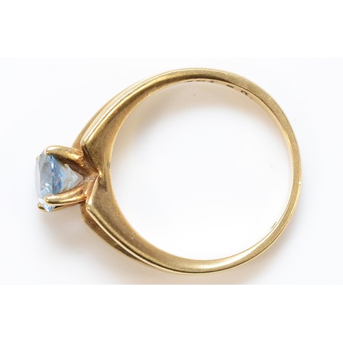 187 - A 9ct gold blue gemstone solitaire ring with V shaped shoulders, 6mm diameter gemstone, L 1/2, 3.1g