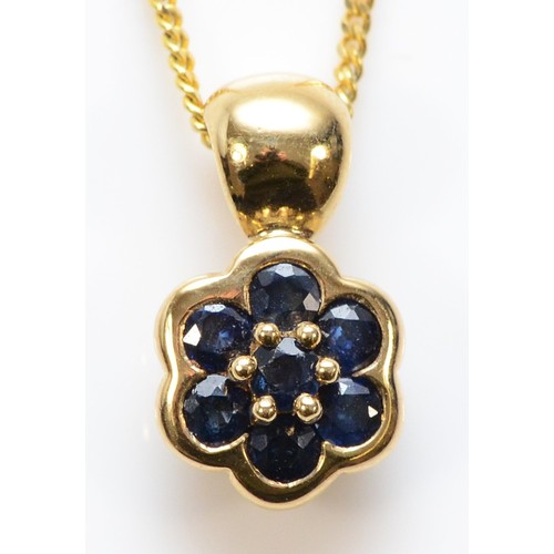 194 - A 9ct gold sapphire daisy shaped cluster pendant, 2.3g