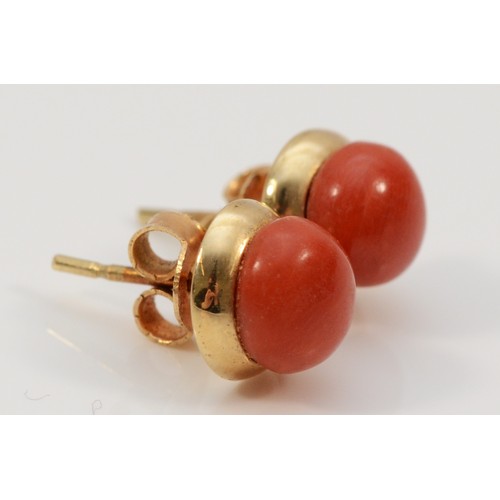 199 - A pair of 9ct gold coral stud earrings with scroll backs, 7mm diameter, 2.4g