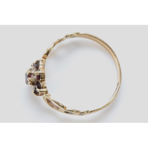 200 - A 9ct gold garnet flower cluster ring, Birmingham 1979, openwork shoulders, L, 1.6g