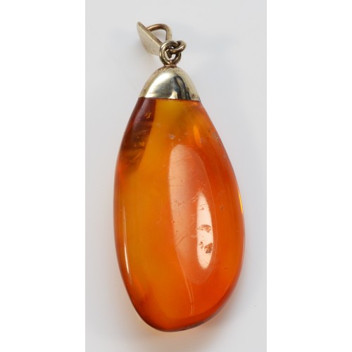 219 - A 9ct gold vintage amber pendant, 40mm x 20mm, 5.6g