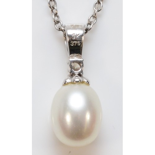 220 - A 9ct white gold diamond and cultured pearl pendant with a chain, 20mm total pendant length, 3.4g