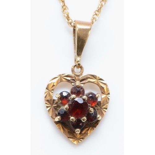 722 - A 9ct gold garnet heart pendant with a chain, 12mm across, 3g