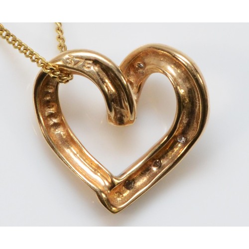 724 - A 9ct gold diamond heart pendant with a chain, 12mm across, 1.6g