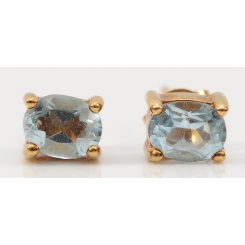 729 - A pair of 9ct gold aquamarine earrings with scroll backs, 0.8g