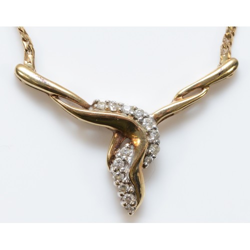 733 - A 9ct gold and diamond necklace with a twisted front, 30mm across, 5.1g