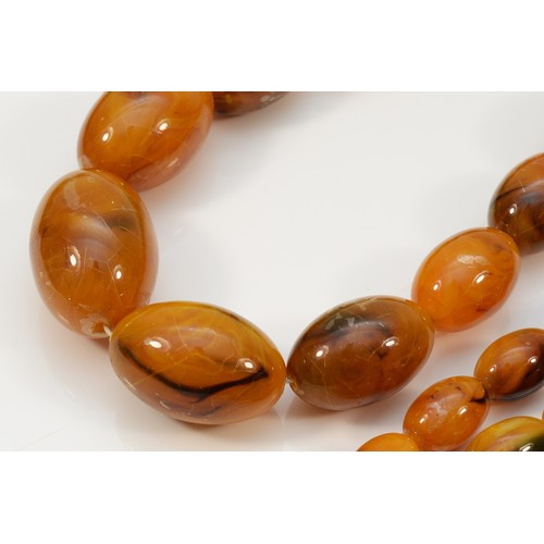 1 - A Bakelite honey amber bead necklace, 24 - 10mm, 36gm and another Bakelite bead necklace