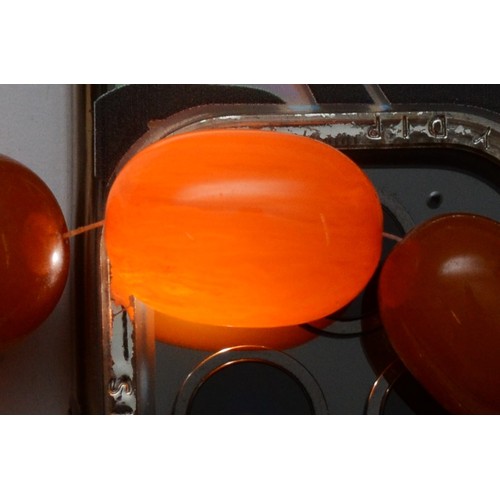 1 - A Bakelite honey amber bead necklace, 24 - 10mm, 36gm and another Bakelite bead necklace