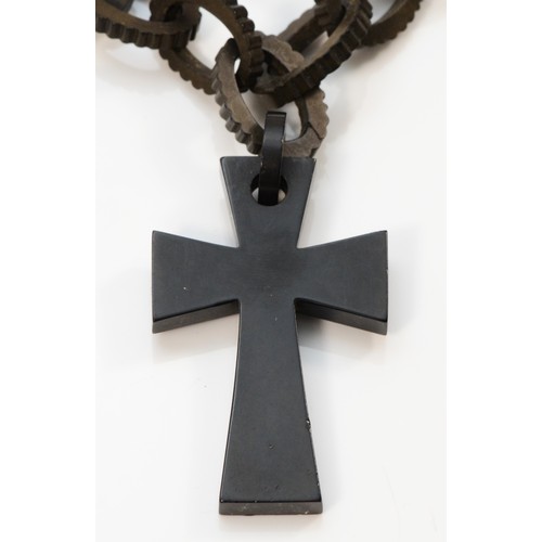 19 - A Victorian jet type cross pendant on chain, cross 6cm, chain 40cm