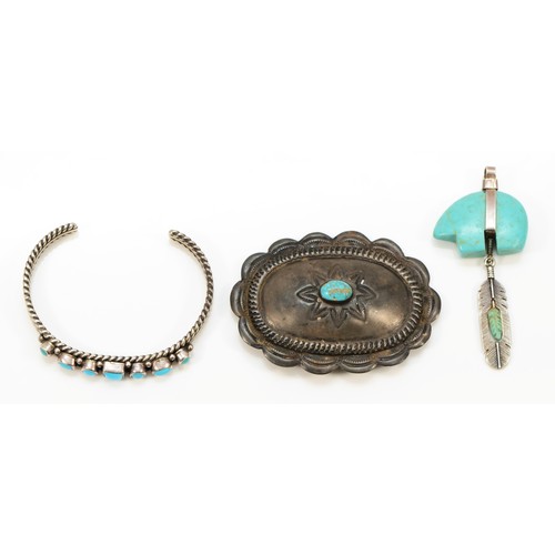 26 - A Native American silver and turquoise feather pendant, 64mm, a turquoise bangle and a brooch (3), 5... 