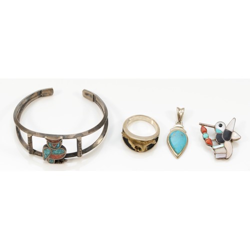 27 - A Native American silver horse ring by OTT, an unmarked owl bangle and two other pieces, 36gm