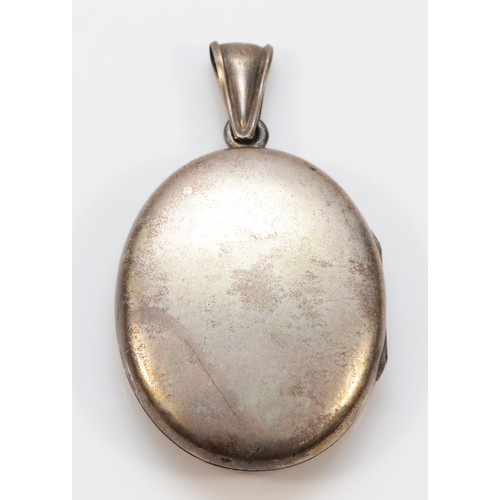 34 - An unmarked silver Victorian Aesthetic Movement locket pendant, 38 x 30mm, 17gm