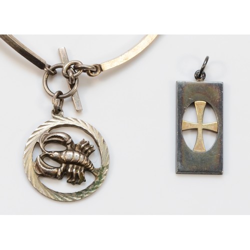 35 - Nina Breddal, a Finnish silver cross pendant, 23mm and a N.E. From Danish silver bracelet with charm... 