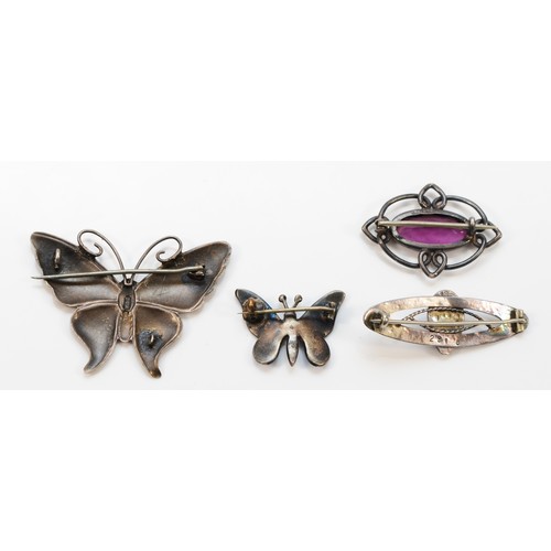 42 - A silver and brownish enamel butterfly brooch, 50mm, damaged, a Charles Horner amethyst paste brooch... 