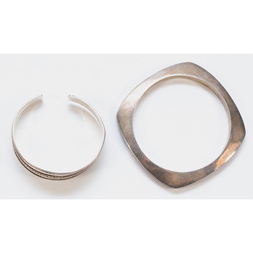 60 - A silver and black enamel bangle, London 2003, 65mm internal, and a 925 silver bangle, 62gm