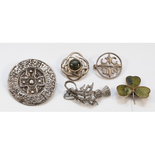 66 - Malcolm Gray, a small circular brooch, 23mm and four other Celtic brooches