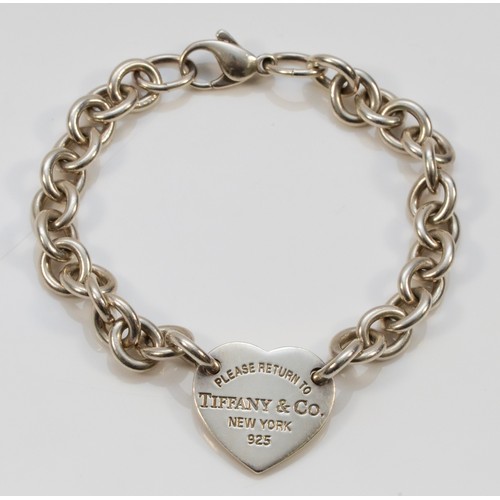 68 - Tiffany & Co., a silver bracelet with heart disc, London 2010, 18.5cm, 25gm