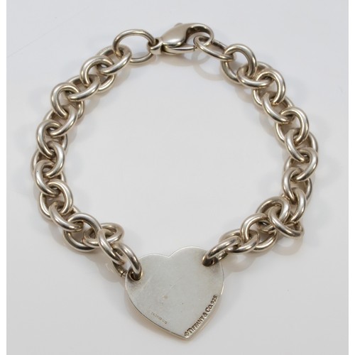 68 - Tiffany & Co., a silver bracelet with heart disc, London 2010, 18.5cm, 25gm