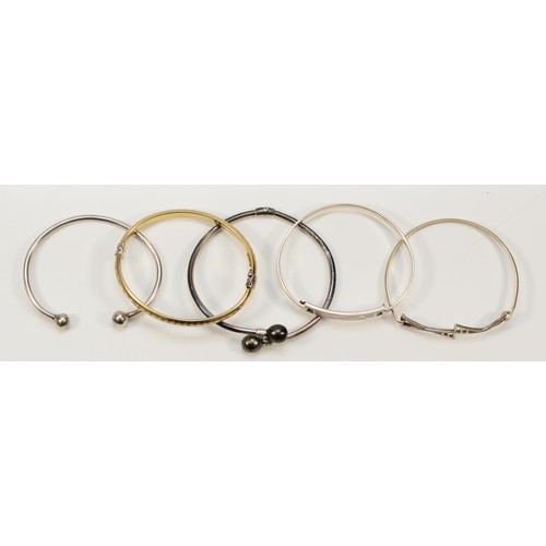 69 - A 925 silver and bonded gold hinged bangle and four silver bangles, 51gm