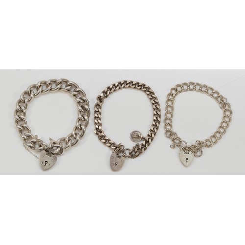 74 - Three silver curb link bracelets, 62gm