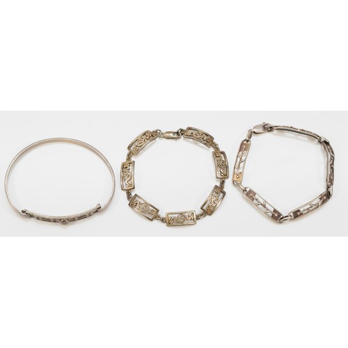 78 - Ola Gorie, a silver five panel link bracelet and two other Celtic silver bracelets, 30gm