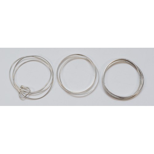 88 - A silver triple interwoven bangle and two 925 examples, 58gm