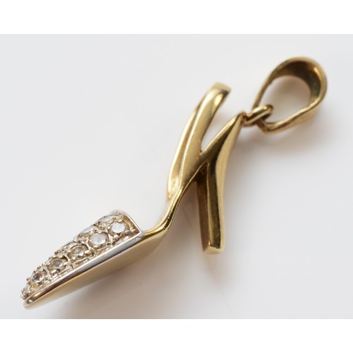 105 - A 9ct gold pendant in the shape of a shoe, colourless stones to the toe section of the shoe, London ... 