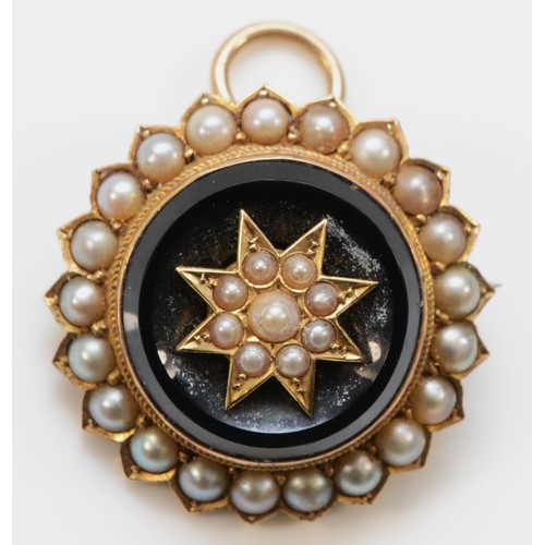 A Victorian unmarked gold, half pearl and onyx target brooch, with star centre and locket back, 25mm, 8.2gm
In very good original condition, no issues, needs a clean