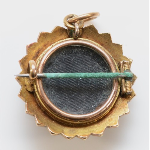 112 - A Victorian unmarked gold, half pearl and onyx target brooch, with star centre and locket back, 25mm... 