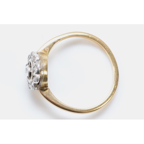 117 - An unmarked Art Deco 18ct gold and old cut diamond cluster ring, P 1/2, 3gm