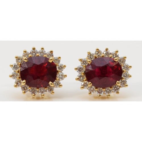 121 - A pair of 18ct gold brilliant cut diamond and glass filled ruby earrings with scroll backs, 13mm x 1... 