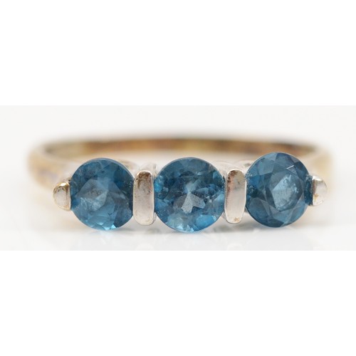 123 - A 9ct white gold blue topaz three stone ring, S 1/2, 3.3g