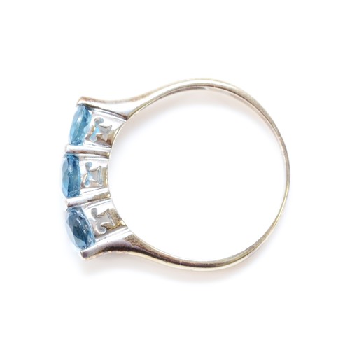 123 - A 9ct white gold blue topaz three stone ring, S 1/2, 3.3g