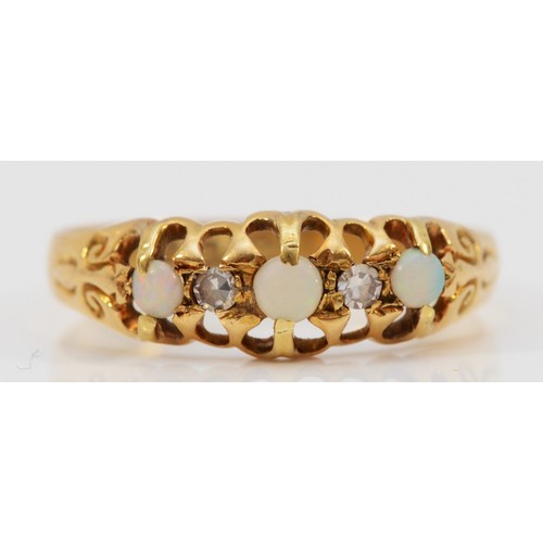 130 - An 18ct gold opal and diamond dress ring, Birmingham 1912, P, 2g