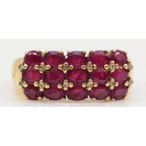 132 - A 9ct gold diamond and ruby three row dress ring, R, 5.3g