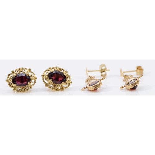 138 - Two pairs of 9ct gold garnet earrings with scroll backs, 2.8g