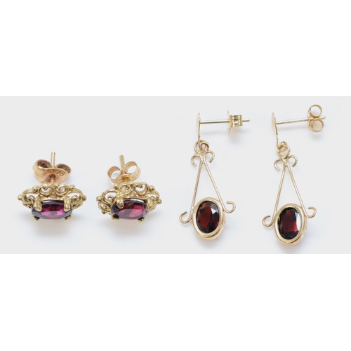 138 - Two pairs of 9ct gold garnet earrings with scroll backs, 2.8g