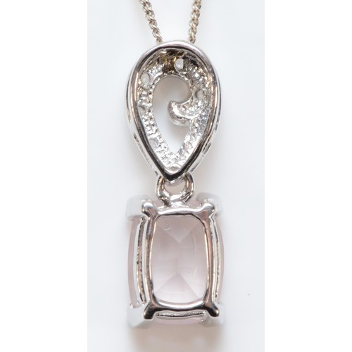 142 - A 9ct white gold pink and white gemstone pendant with a chain, 20mm pendant drop, 2.9g