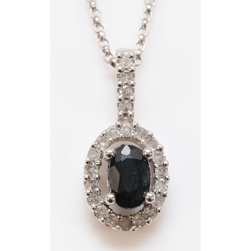 151 - A 9ct white gold sapphire and diamond cluster pendant with a chain, 17mm drop, 3.1g