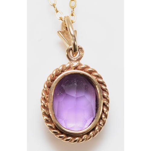 152 - A 9ct gold amethyst pendant with a chain, 10mm x 8mm amethyst, 2.6g